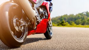 Close-up of a red sport motorcycle parked on a roadway, representing motorcycle accident claims in Cave Creek.