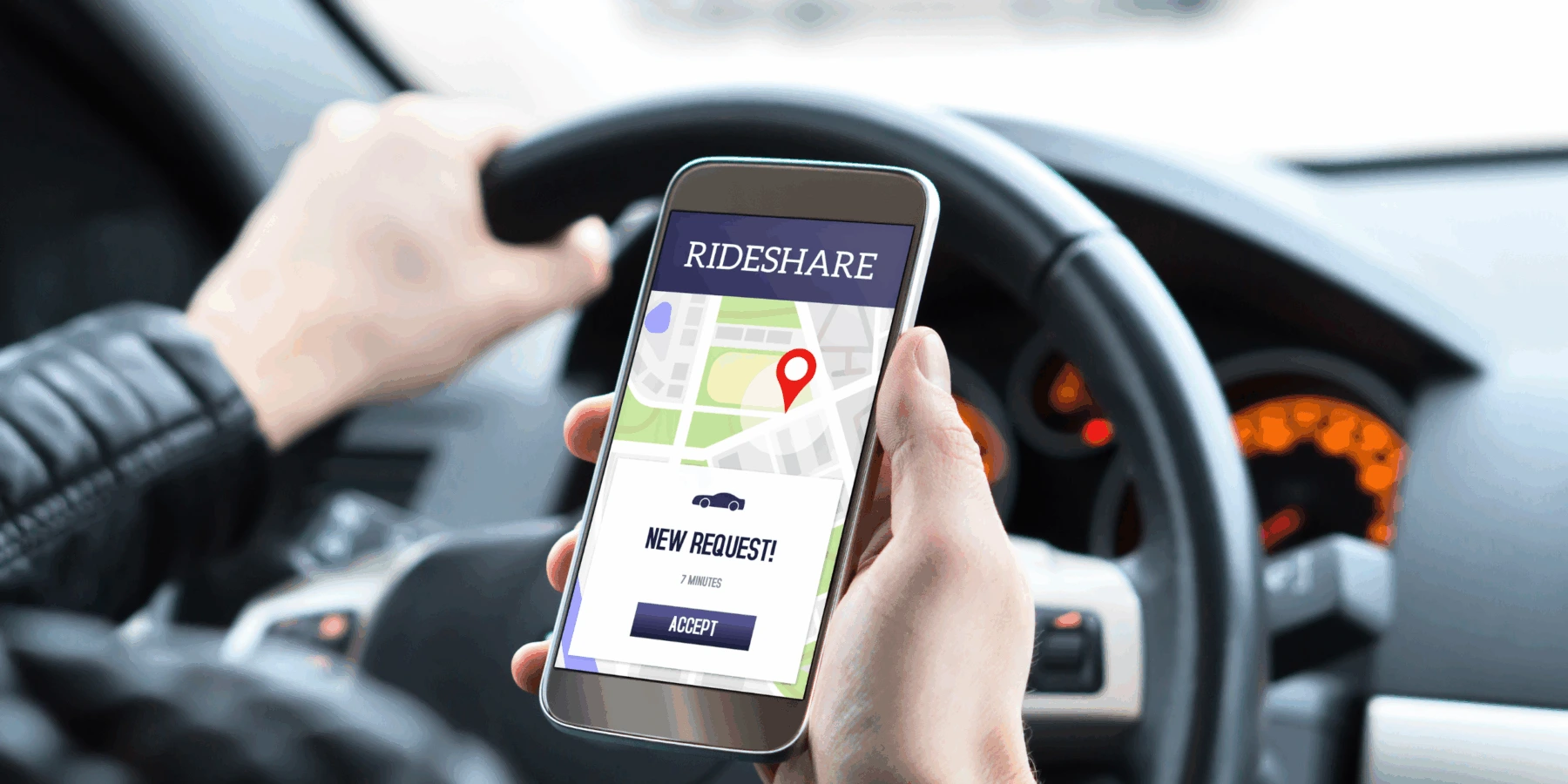 A driver holding a smartphone showing a "New Request!" notification on a rideshare app inside a car.