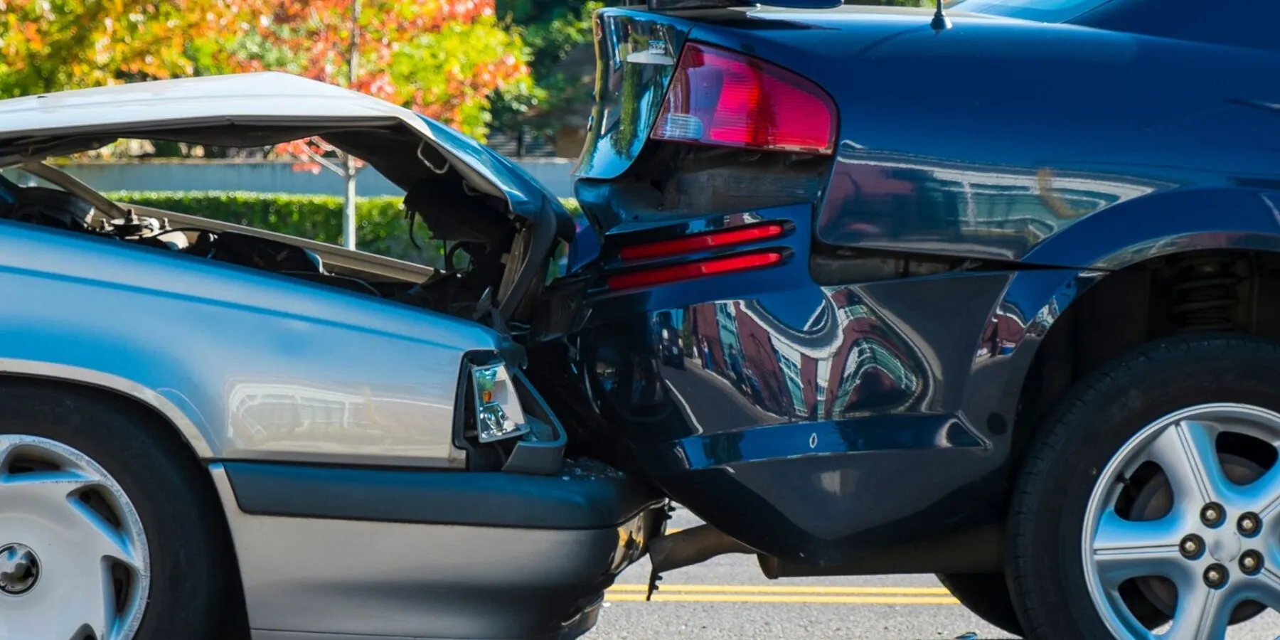A rear-end collision between two cars.